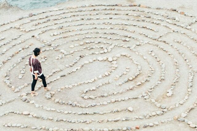person walking on beach during daytime